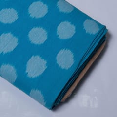 White base with sky blue dot cotton ikat fabric